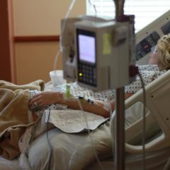 woman laying in hospital bed